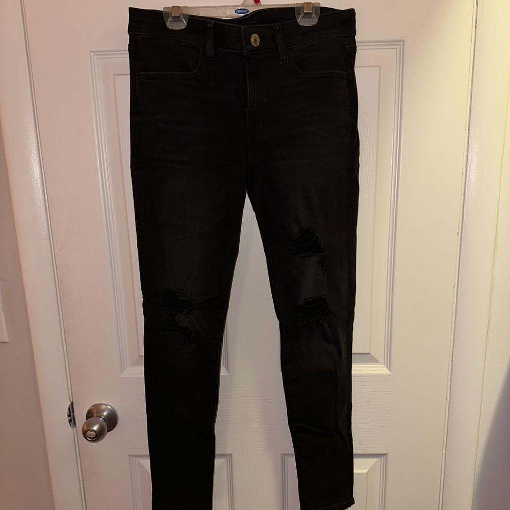 Black distressed mid rise jeans. Size 8.
